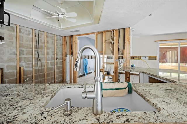 kitchen with ceiling fan and sink