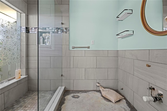 bathroom with tiled shower