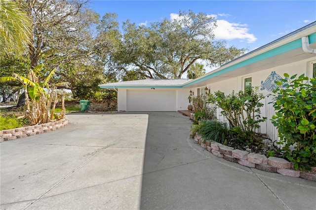 view of side of property with a garage