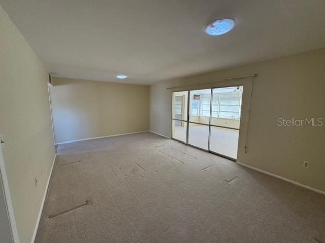 empty room with carpet flooring