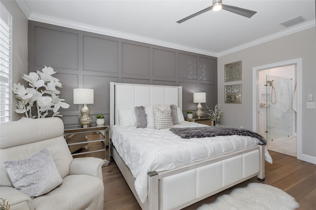 bedroom featuring wood-type flooring, ornamental molding, ceiling fan, and ensuite bathroom