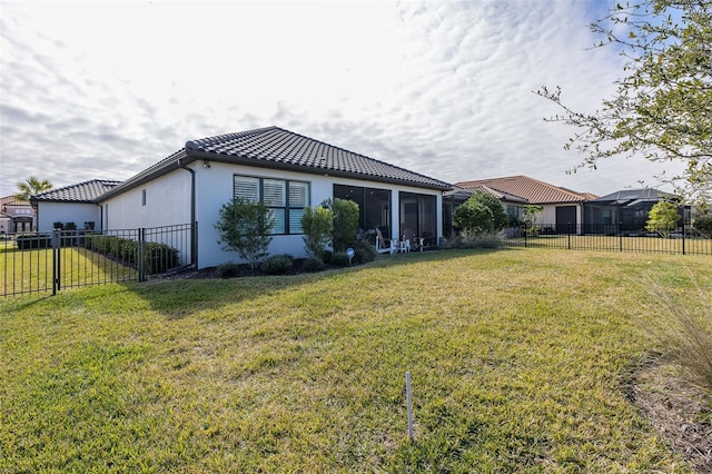 rear view of house with a lawn