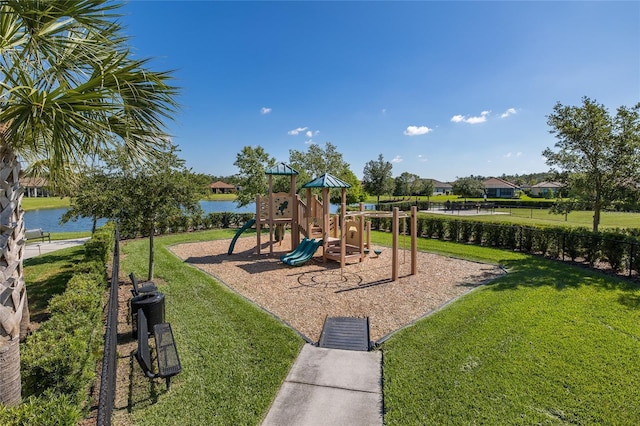 view of playground featuring a water view and a yard