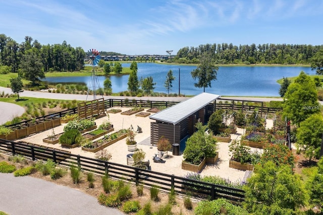 birds eye view of property with a water view