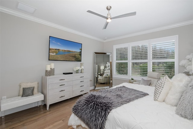 bedroom featuring wood-type flooring, crown molding, and ceiling fan