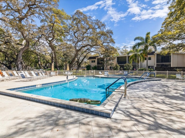 view of swimming pool with a patio