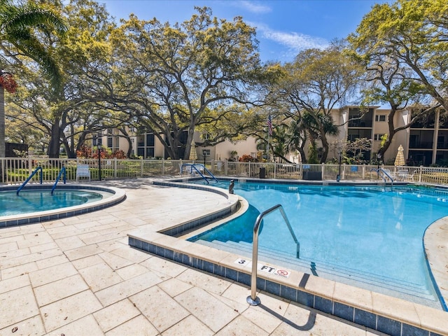 view of swimming pool with a patio