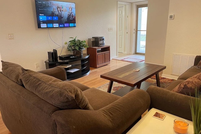 living room with light hardwood / wood-style floors