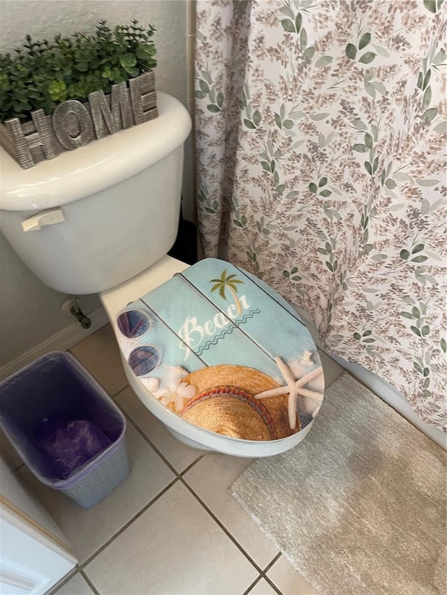 bathroom featuring tile patterned floors and toilet