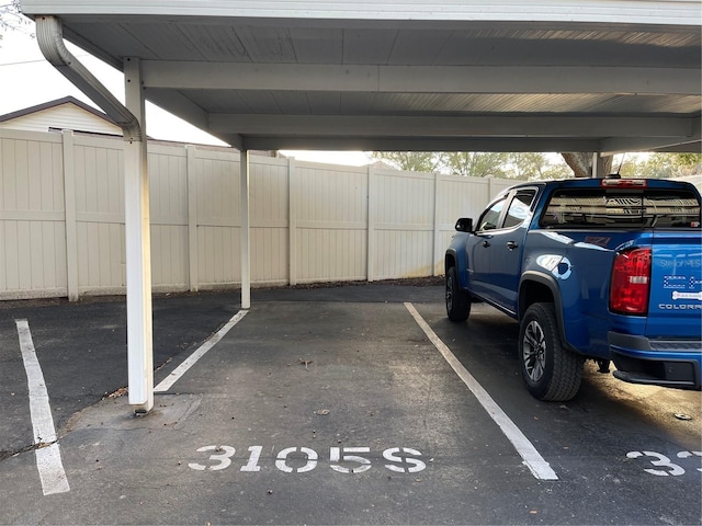 view of parking / parking lot with a carport