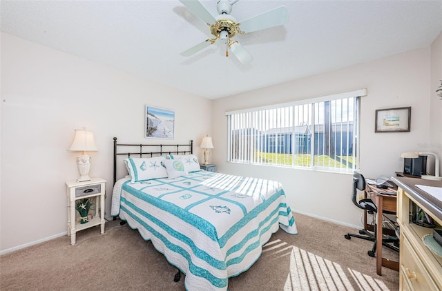 bedroom featuring light carpet and ceiling fan