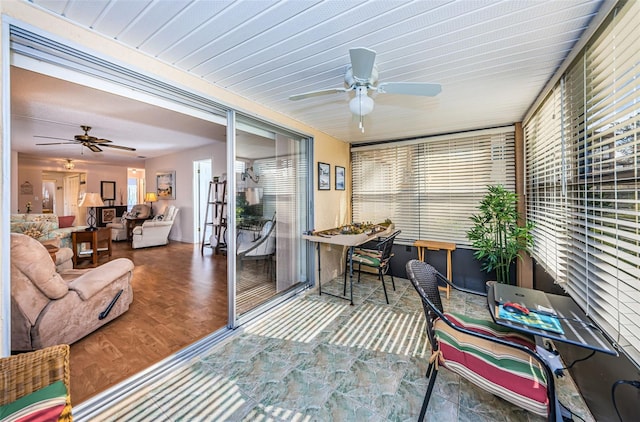 sunroom / solarium with ceiling fan