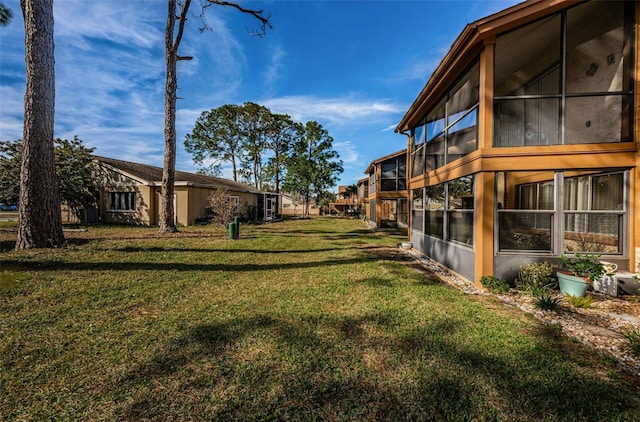 view of yard featuring a sunroom