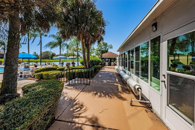 exterior space featuring a patio and a water view