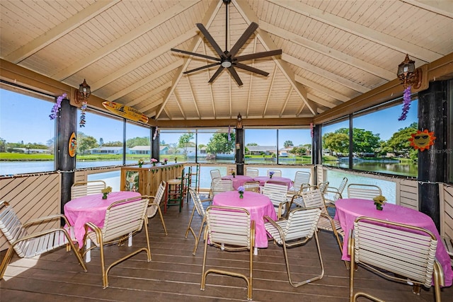 wooden terrace with a gazebo, ceiling fan, and a water view