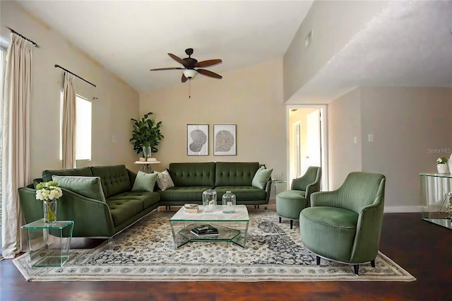 living room with lofted ceiling, ceiling fan, and dark hardwood / wood-style floors