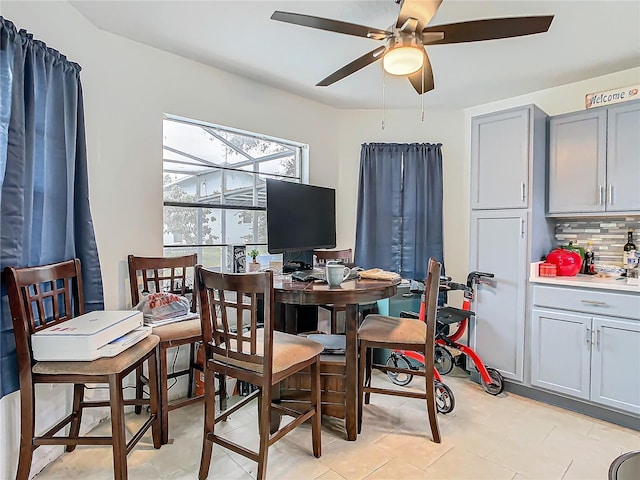 dining space featuring ceiling fan