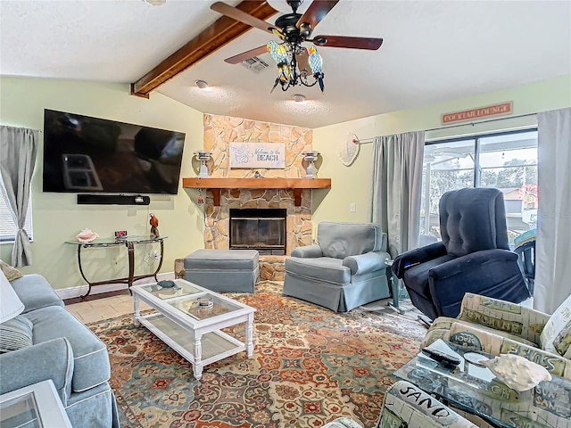 living room featuring ceiling fan, lofted ceiling with beams, and a fireplace