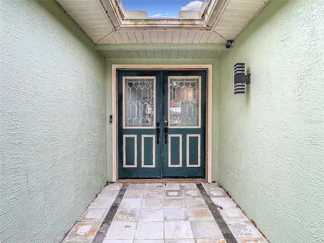 12529 Shadow Ridge Blvd, Hudson, FL 34669 - doorway to property with stucco siding and french doors