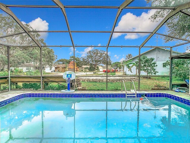 12529 Shadow Ridge Blvd, Hudson, FL 34669 - outdoor pool featuring glass enclosure