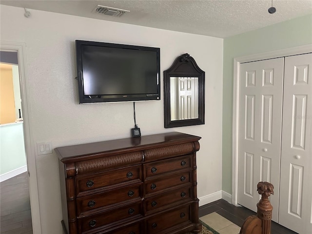 12529 Shadow Ridge Blvd, Hudson, FL 34669 - bedroom with a closet, baseboards, and a textured ceiling
