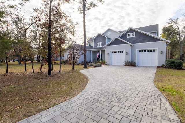 view of front of house featuring a garage and a front yard