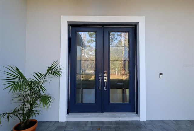 entrance to property featuring french doors