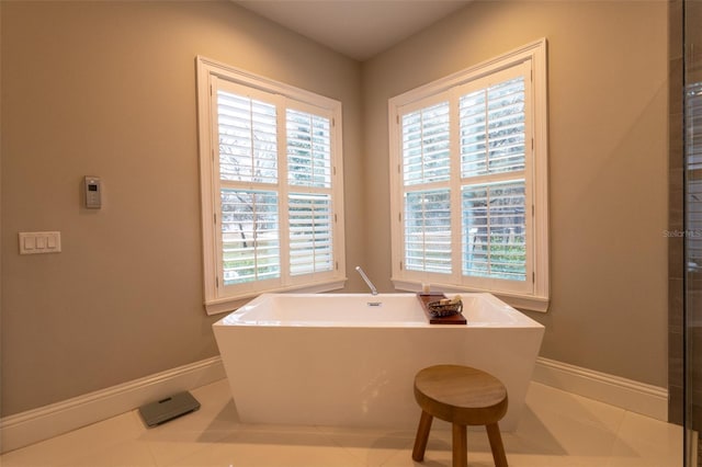 bathroom featuring tile patterned floors and a bathing tub