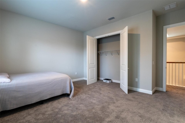 bedroom with a closet and carpet flooring