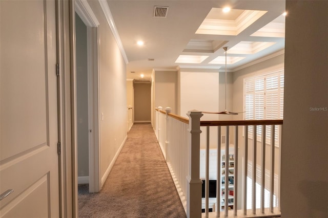 hall featuring coffered ceiling, beamed ceiling, ornamental molding, and light carpet