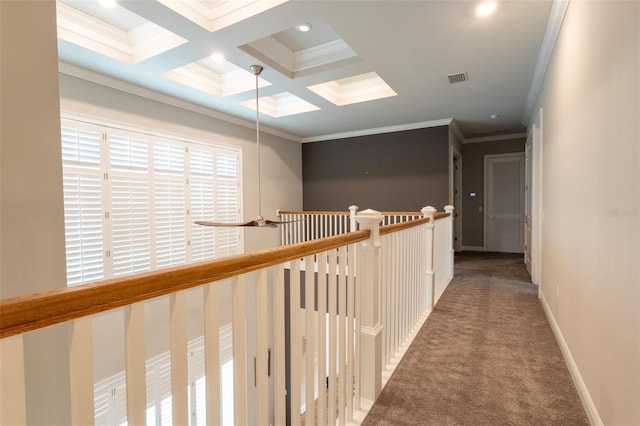 hallway with crown molding, coffered ceiling, carpet floors, and beam ceiling