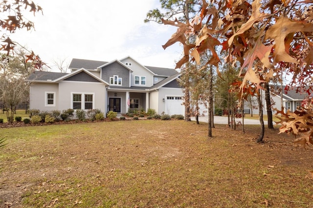 view of front of house with a garage and a front yard