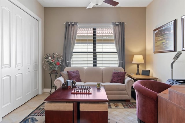 living room with light tile patterned flooring and ceiling fan