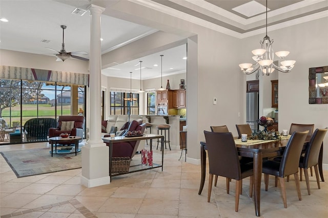 dining room featuring ceiling fan with notable chandelier, ornamental molding, and ornate columns