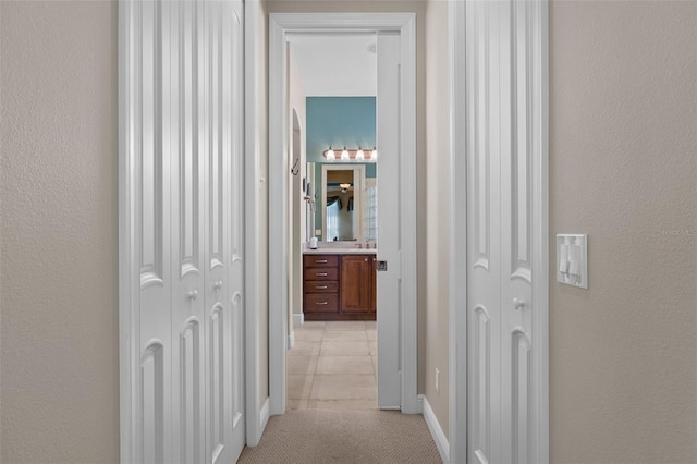 hallway with light tile patterned flooring