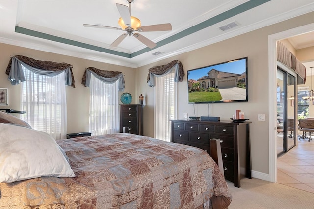 tiled bedroom featuring multiple windows, crown molding, a raised ceiling, and ceiling fan