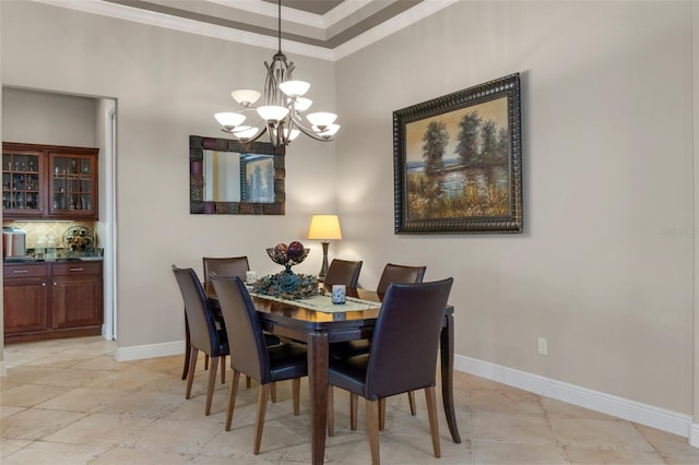 dining space featuring crown molding