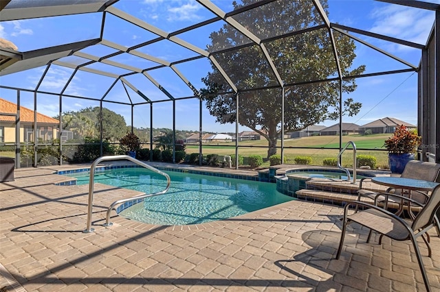 view of swimming pool with a lanai, a patio, and an in ground hot tub