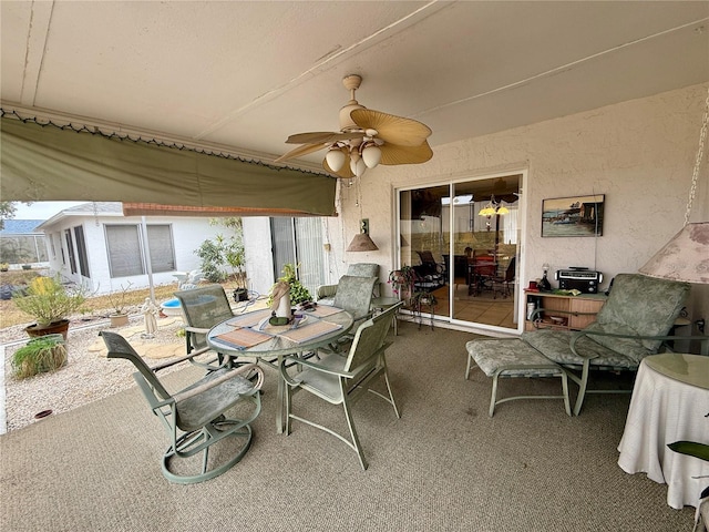 view of patio / terrace featuring ceiling fan