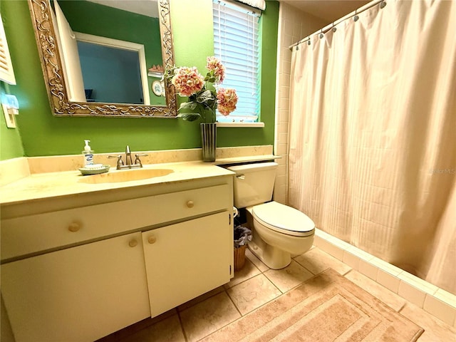 bathroom with vanity, tile patterned floors, and toilet