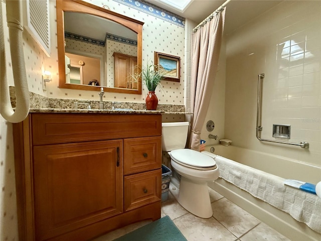 full bathroom featuring tile patterned flooring, vanity, shower / tub combo, and toilet