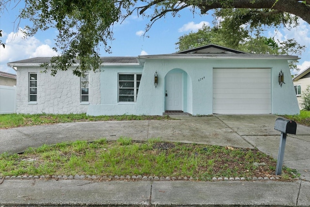 single story home featuring a garage