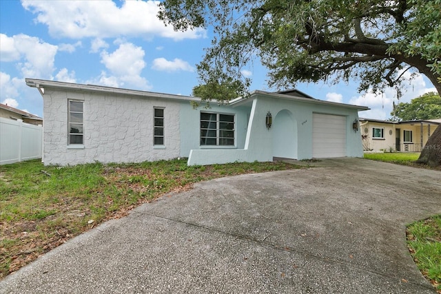 single story home with a garage