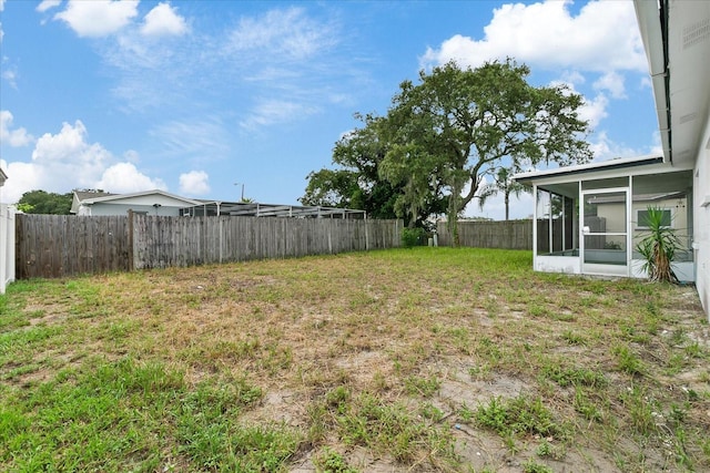 view of yard with a sunroom