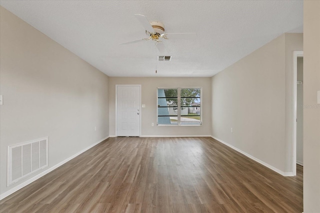 unfurnished room with hardwood / wood-style flooring, a textured ceiling, and ceiling fan