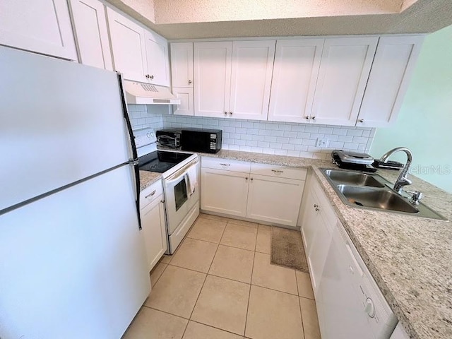 kitchen with white cabinetry, sink, white appliances, and light tile patterned floors