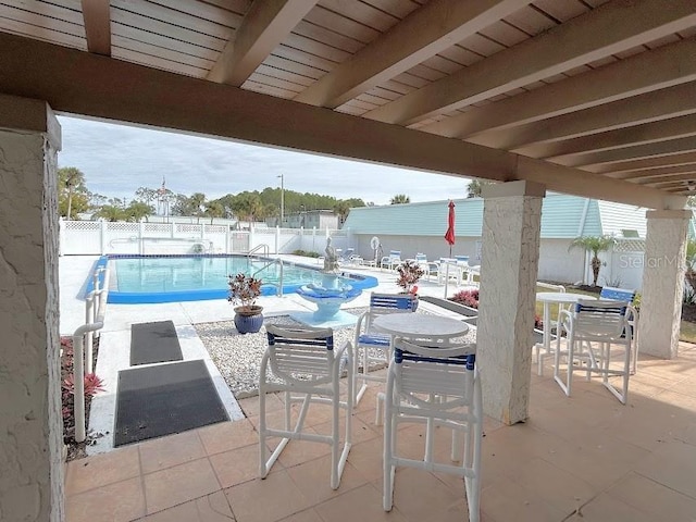 view of swimming pool featuring a patio