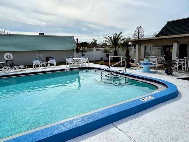 view of swimming pool featuring a patio