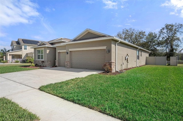 view of front of property featuring a garage, driveway, a front lawn, and stucco siding