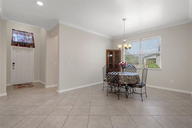 dining area featuring crown molding, light tile patterned flooring, baseboards, and an inviting chandelier